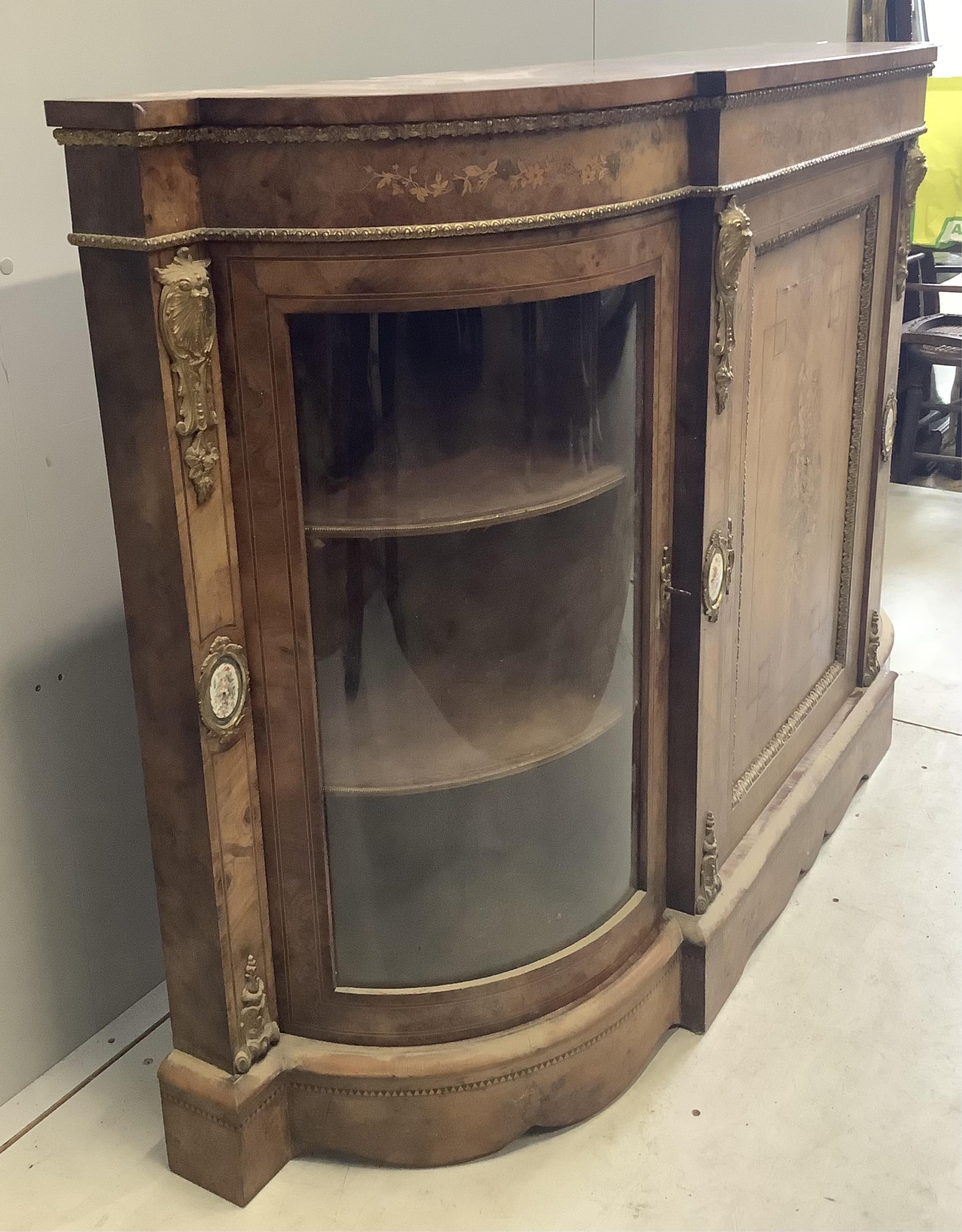 A Victorian marquetry inlaid, gilt metal mounted bowfront side cabinet